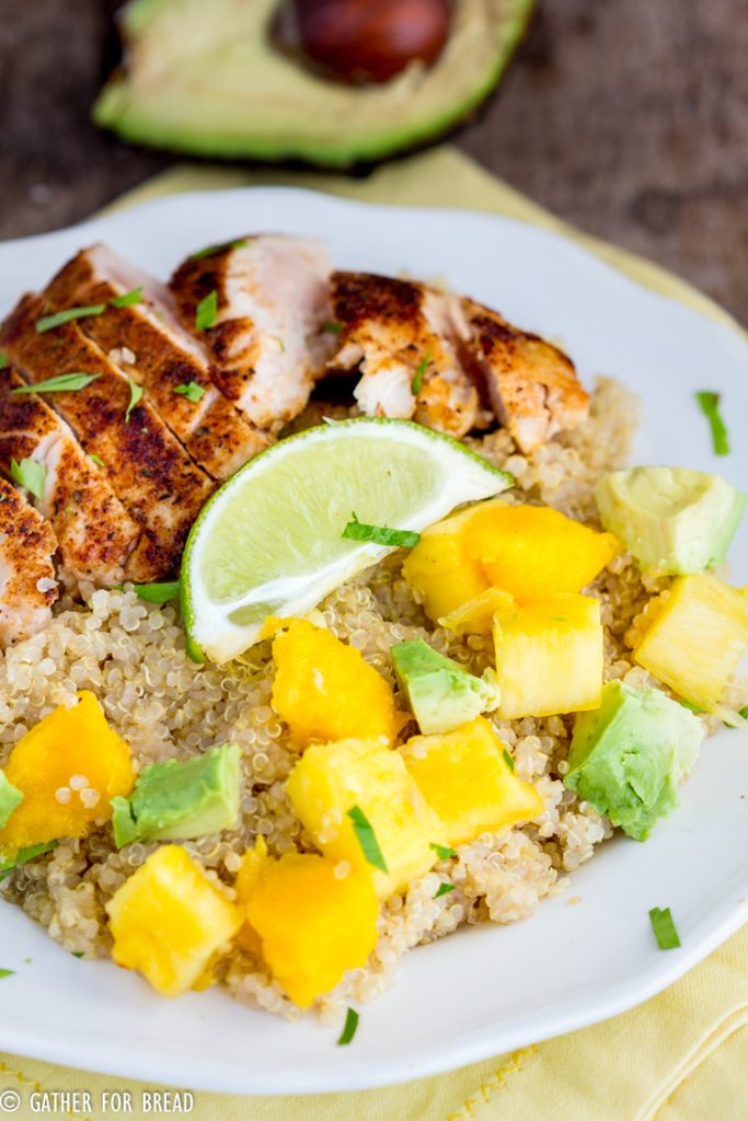 Blackened Chicken Quinoa Salad with Pineapple Mango Avocado -  Earth grains and blackened chicken are topped with fresh mango, avocado and pineapple with homemade vinaigrette. This healthy nutritious meal leaves you full and it's so good for you!