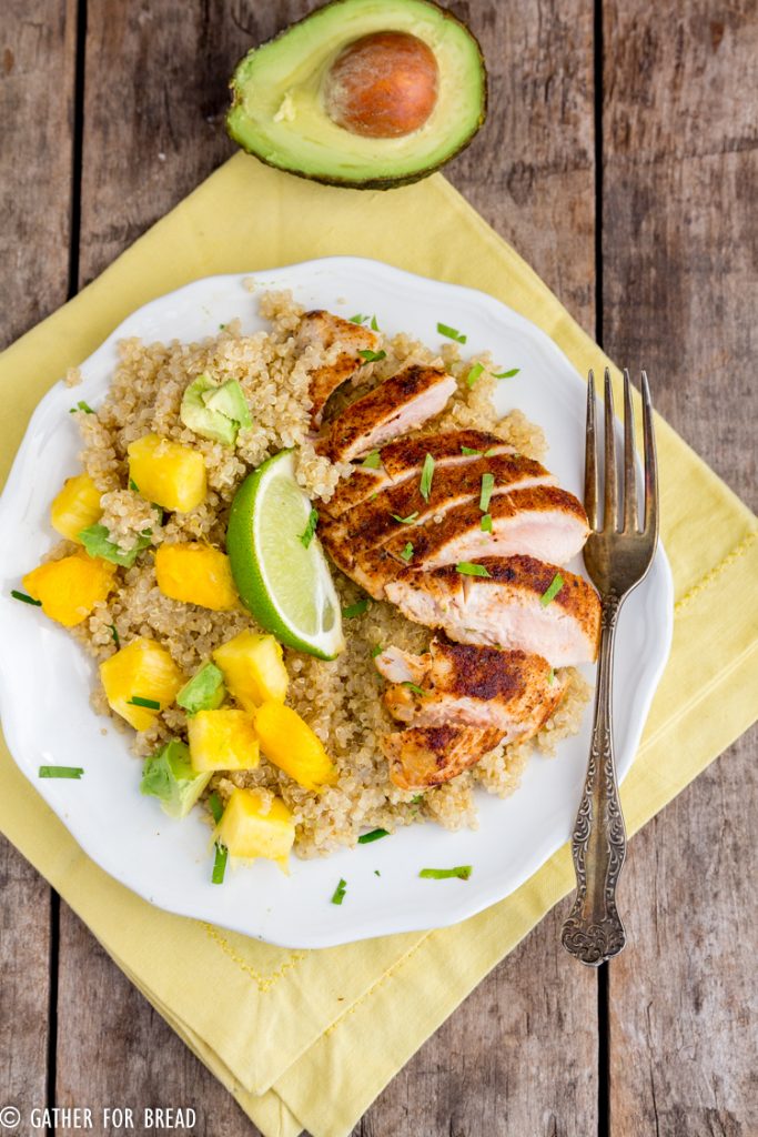 Main dish with quinoa, blackened chicken topped with pineapple, mango and avocado makes a healthy nutritious meal!
