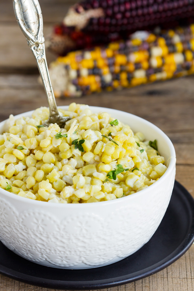Creamy Parmesan Baked Corn - Blend of sweet corn, fresh Parmesan and a cream sauce made with half and half. Perfect baked summer side dish and holiday favorite. My family loves this casserole.