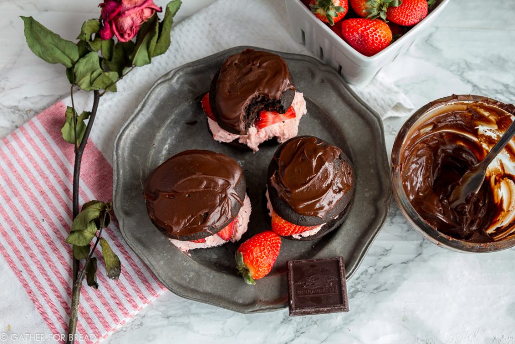 Chocolate Covered Strawberry Whoopie Pies - Chocolate cookies stuffed with fresh strawberry filling, and a chocolate ganache. Like chocolate covered strawberries and a cookie all in one! Perfect to share with your love on Valentine's or any day of the year!