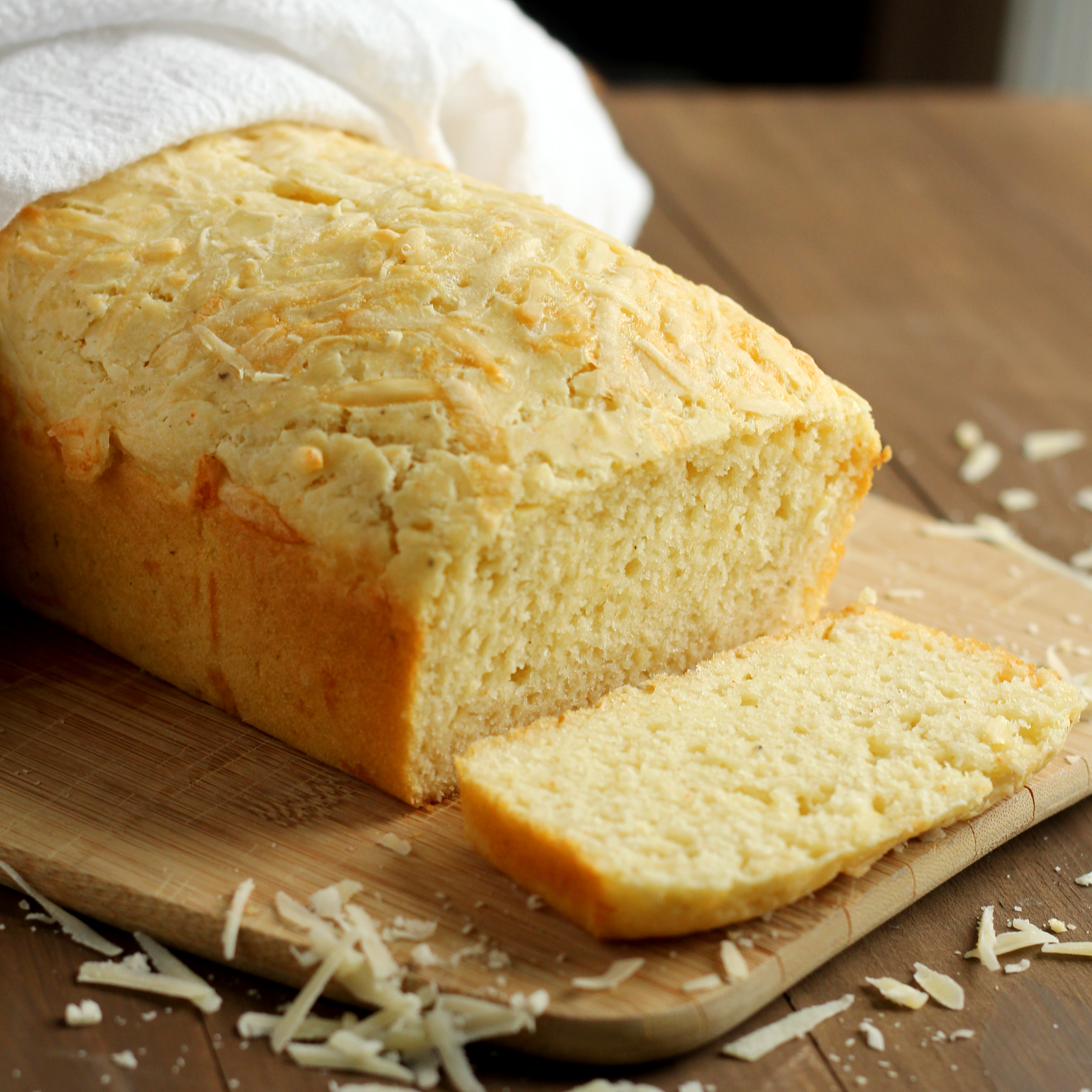 Quick, simple bread made with Parmesan and cheddar cheeses. The perfect addition to any meal. Serve alone or with honey or butter. It's delicate and tasty!