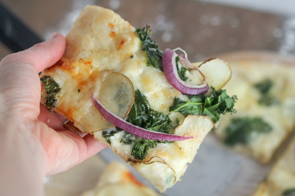  Freshly made pizza topped with thinly sliced potato, kale, red onion, a hint of garlic and delicious cheeses. One of the best pizza combo toppings ever! gatherforbread.com