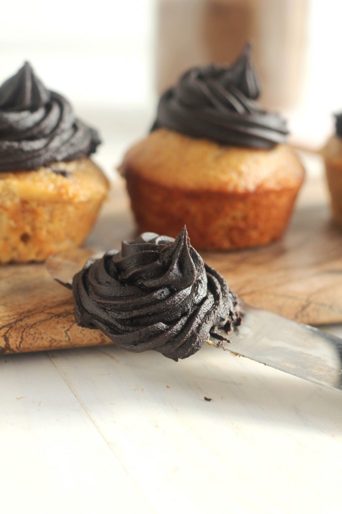 Banana Cupcakes with Dark Chocolate Frosting | A moist banana cupcake topped with rich dark chocolate frosting