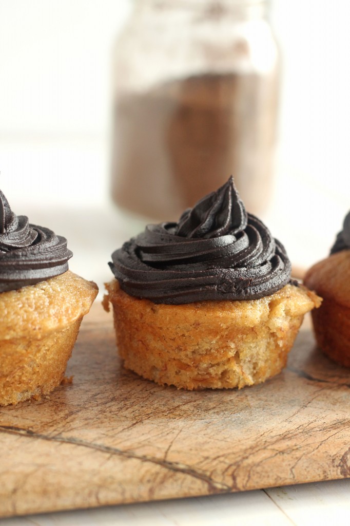 Banana Cupcakes with Dark Chocolate Frosting | A moist banana cupcake topped with rich dark chocolate frosting