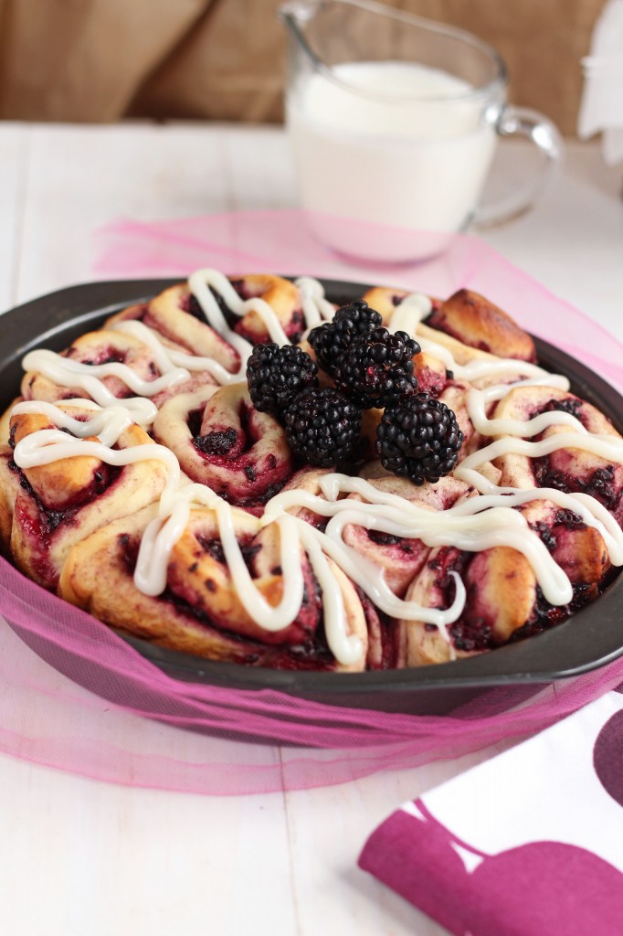 Blackberry Cinnamon Rolls - Homemade soft cinnamon rolls made with fresh blackberries. For summer brunch or breakfast. These yeast buns are a favorite. Cream Cheese drizzle topping makes them irresistible.