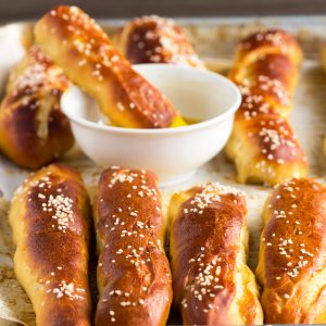 German Soft Pretzel Sticks - How to make homemade slightly sweet golden soft pretzel sticks with yeast. Makes enough for a crowd as an appetizer and great for the big game.