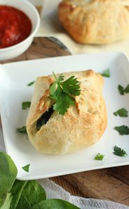 Crispy baked puffs of dough stuffed with your favorite cheesy spinach artichoke mixture.