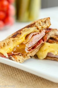 Bacon Ham Grilled Cheese Brown Sugar Mustard Sauce - Delicious gooey grilled cheese sandwiches stuffed with bacon, ham and cheese. Grilled with a warm brown sugar mustard sauce. 