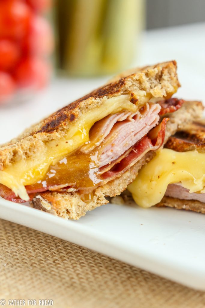 Bacon Ham Grilled Cheese Brown Sugar Mustard Sauce - Delicious gooey grilled cheese sandwiches stuffed with bacon, ham and cheese. Grilled with a warm brown sugar mustard sauce. 