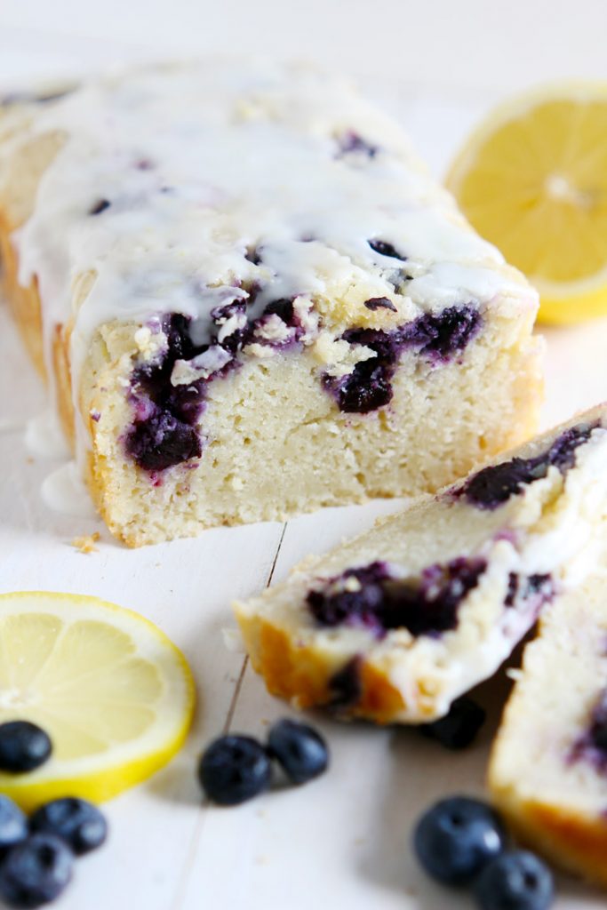Lemon Blueberry Yogurt Bread - Homemade moist lemon bread with fresh blueberries, topped with a lemon glaze. Made with Greek yogurt as a healthy choice. Great quick bread to serve in the summer.