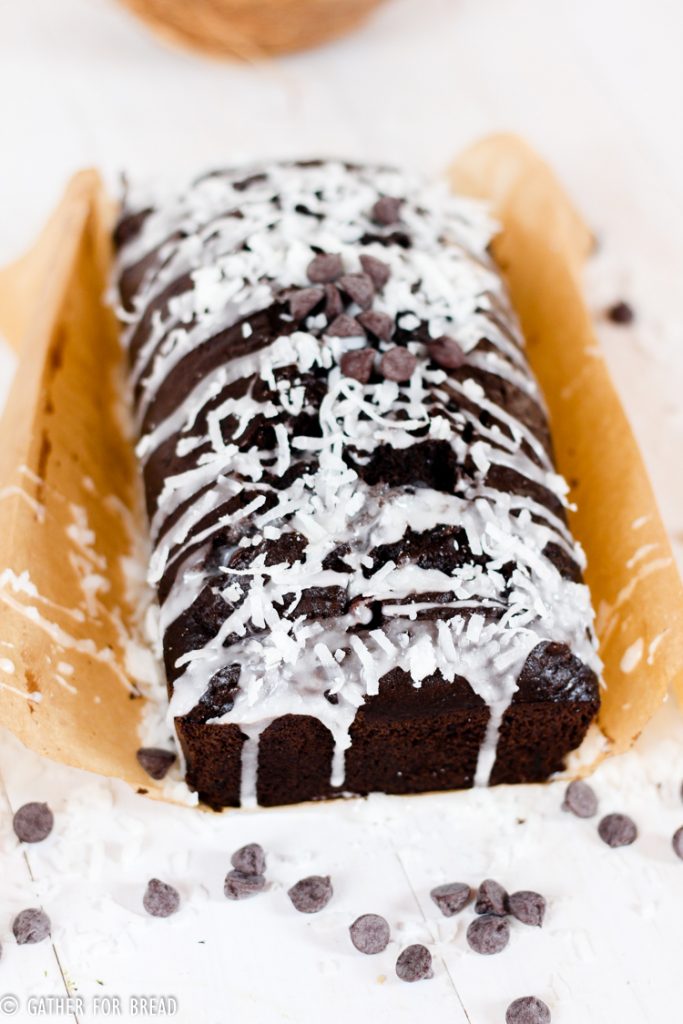  Dark Chocolate Zucchini Bread with Coconut Glaze - Recipe for moist chocolate zucchini quick bread topped with a coconut glaze. The recipe makes a sweet homeade loaf that's perfect for summer.