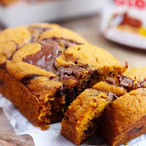 Nutella Swirled Pumpkin Bread - Moist pumpkin bread swirled with a delicious flavor of Nutella. Chocolate and pumpkin pair up perfectly in these fall loaves. A favorite autumn quick bread.