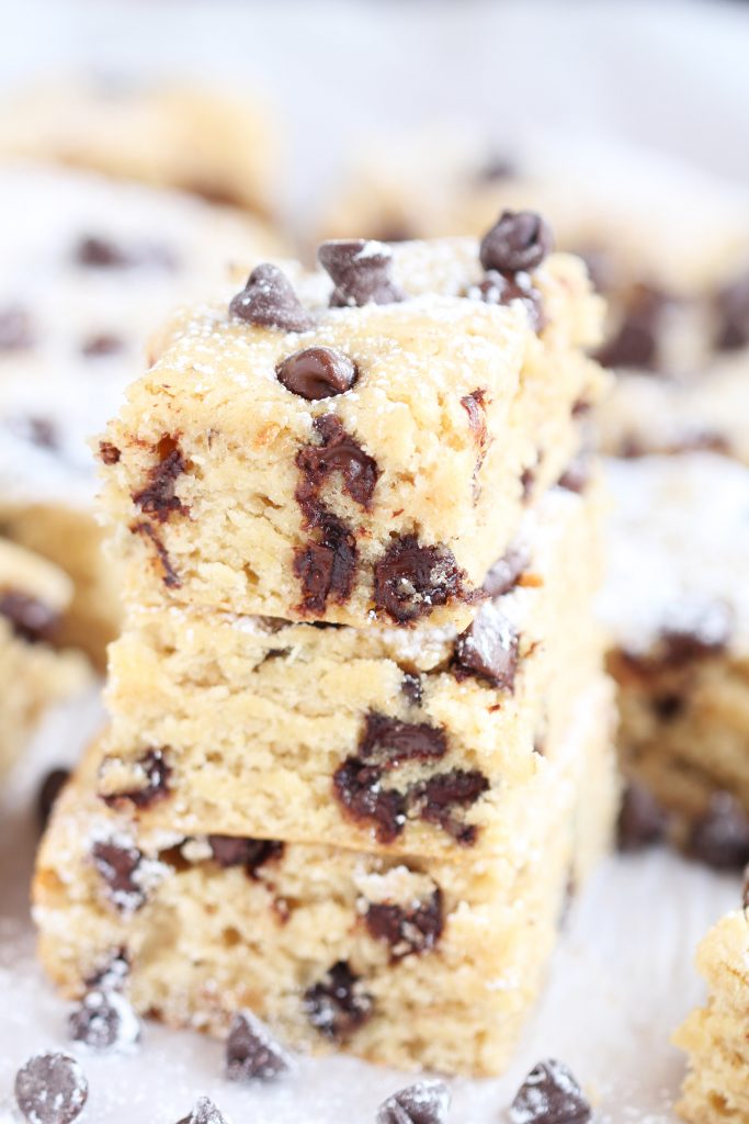Skinny Banana Chocolate Chip Snack Bars - Amazing snack bars made lighter with Greek yogurt. Fabulous recipe whips up in just a few minutes. Perfect for ripened bananas!
