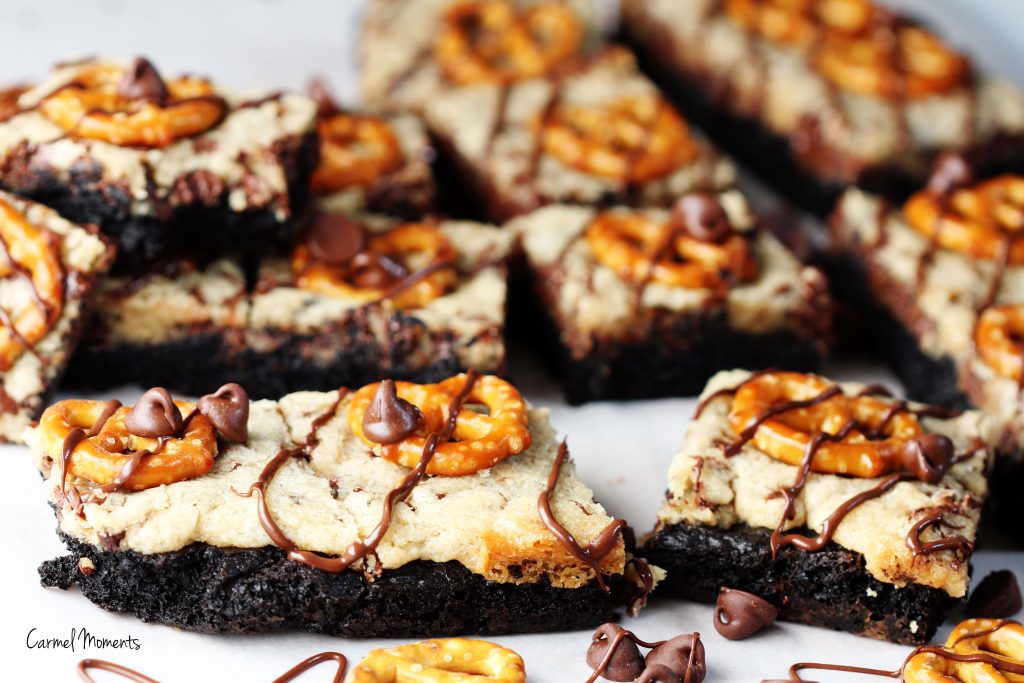 Cookie Dough Pretzel Brownies - Delicious layers of brownie and cookie dough topped with crunchy pretzels and chocolate drizzle.
