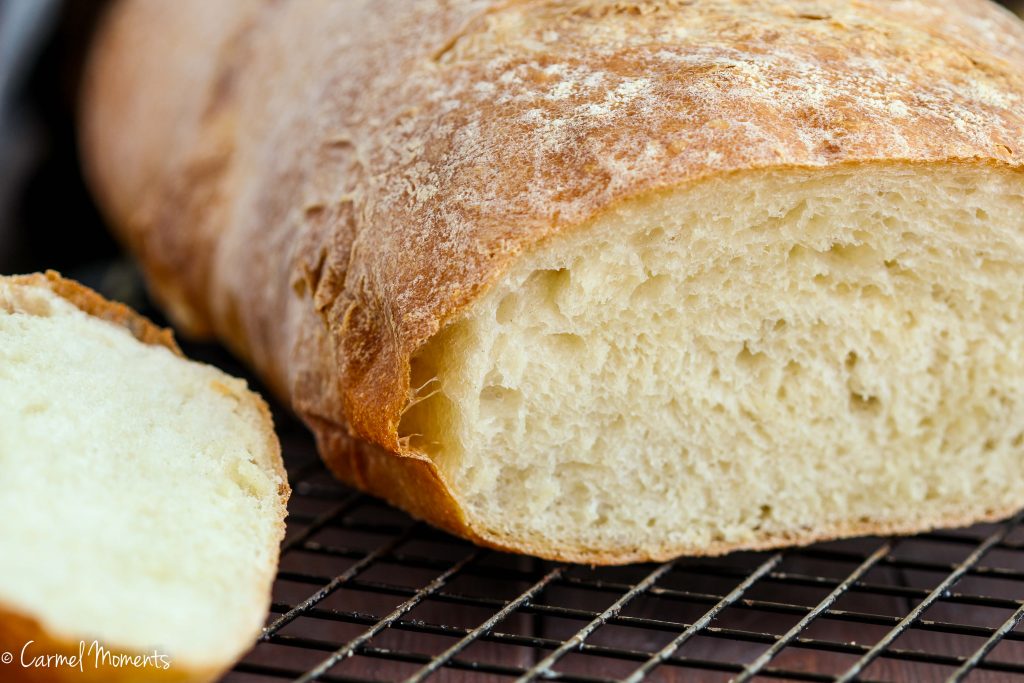 Rustic Italian Bread - This crusty Italian bread loaf makes the perfect addition to the dinner table. A great side for pasta, soup and Sunday dinner. 