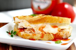 Buffalo Chicken Grilled Cheese - This grilled cheese sandwich bread is stuffed with melty cheese, rotisserie chicken smothered with hot sauce for the ultimate buffalo chicken sandwich.