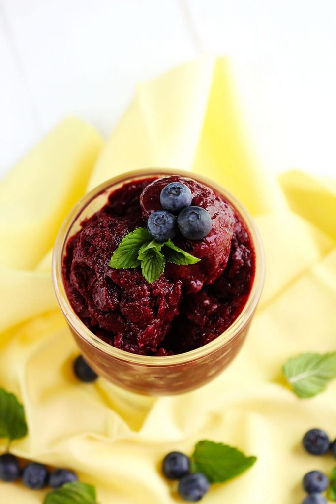 Blueberry Buttermilk Sherbert - Delicious creamy sherbert made with fresh blueberries, buttermilk a hint of vanilla and topped with fresh mint for garnish. Perfect summer dessert to cool down.