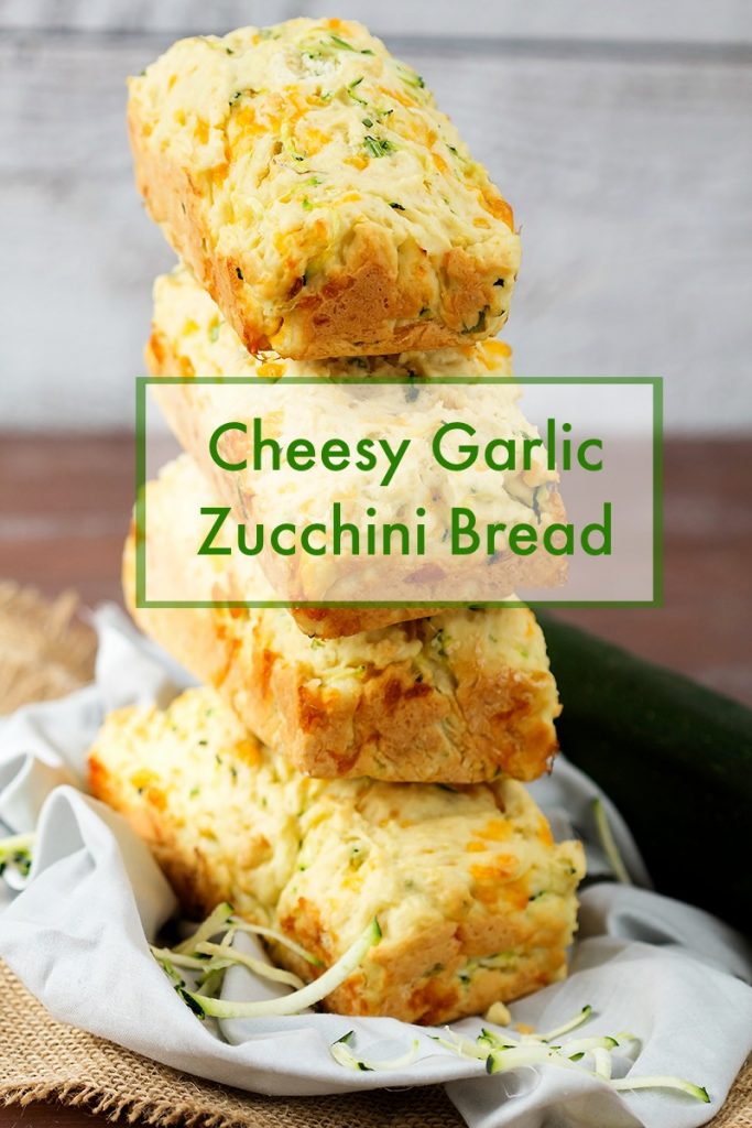 Delicious homemade fresh zucchini bread with cheddar cheese and garlic. Simple tasty recipe is the perfect summer appetizer or side to every meal.