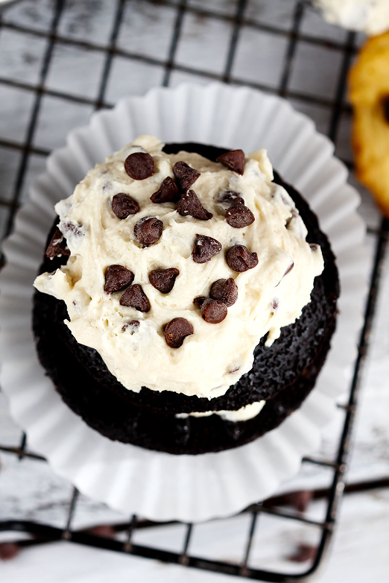 Delicious moist chocolate cupcakes made with chopped chocolate stuffed, topped with chocolate chip cookie dough frosting. Ultimate cupcake lover's favorite.