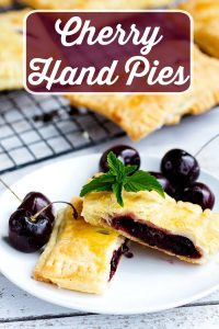 Sweet Cherry Hand Pies - Handheld cherry pies made with sweet fresh cherries. All whole ingredients, made with real dough, make a perfect summer dessert that's easy to share and great for hands.