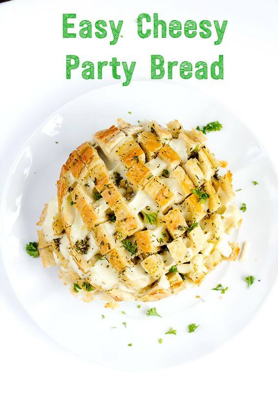 Easy Cheesy Party Bread - Garlic, buttery, pull apart mozzarella, this cheesy bread is the perfect easy appetizer for parties, game time and summer picnics.