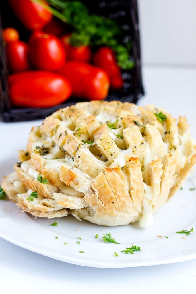 Easy Cheesy Party Bread - Garlic, buttery, pull apart mozzarella, this cheesy bread is the perfect easy appetizer for parties, game time and summer picnics.