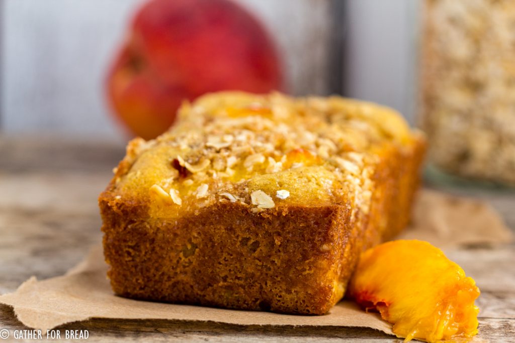 Peach Streusel Quick Bread - Homemade quick bread made with fresh peaches and topped with a crunchy oat streusel. Sweet loaf that's perfect for summer!