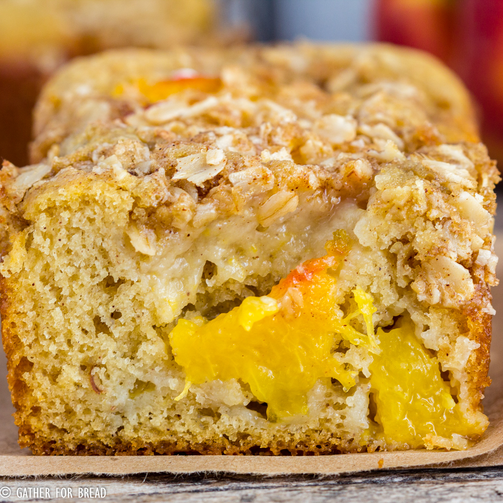 Peach Streusel Quick Bread - Homemade quick bread made with fresh peaches and topped with a crunchy oat streusel. Sweet loaf that's perfect for summer!
