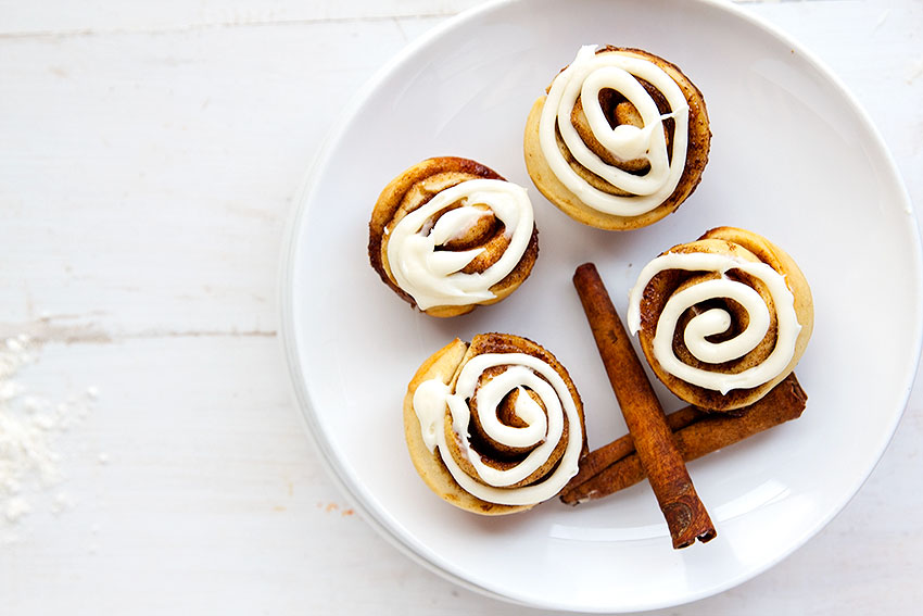 Mini Cinnamon Rolls - These homemade mini rolls are perfect for breakfast and desserts. Grab and go style wrapped up with buttery cinnamon goodness and topped with a delicious cream cheese glaze. // gatherforbread.com