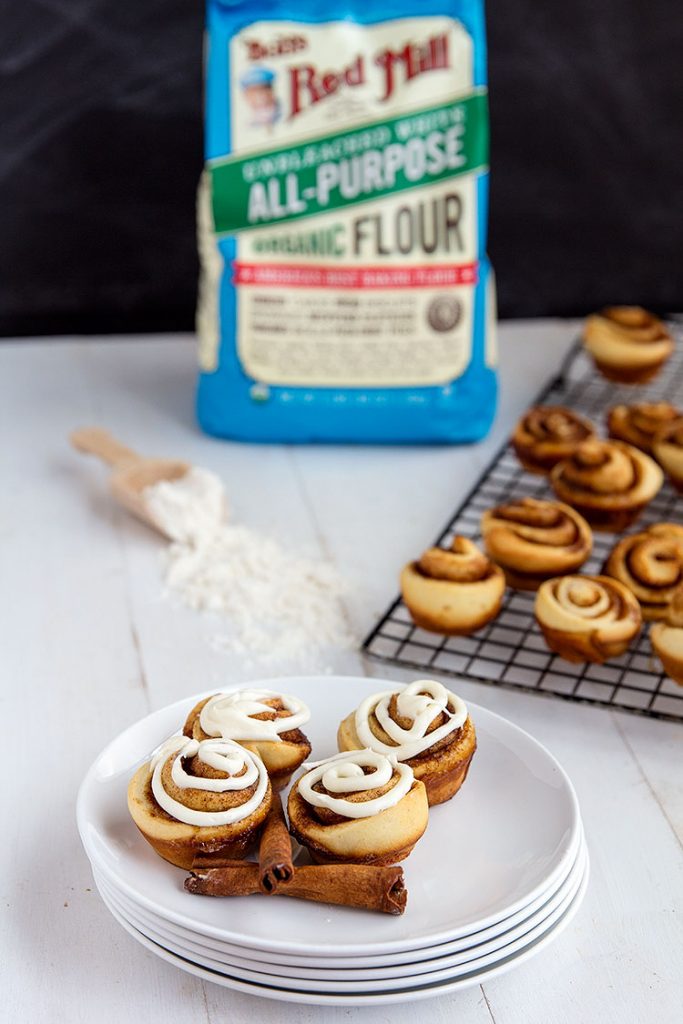 Mini Cinnamon Rolls - These homemade mini rolls are perfect for breakfast and desserts. Grab and go style wrapped up with buttery cinnamon goodness and topped with a delicious cream cheese glaze. // gatherforbread.com