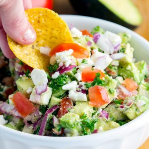Avocado Feta Dip - Delicious addicting 'crack' dip made with feta cheese, fresh tomatoes, avocado chunks, vinaigrette, and herbs. Can't get enough of this healthy fresh blend. Perfect party appetizer.