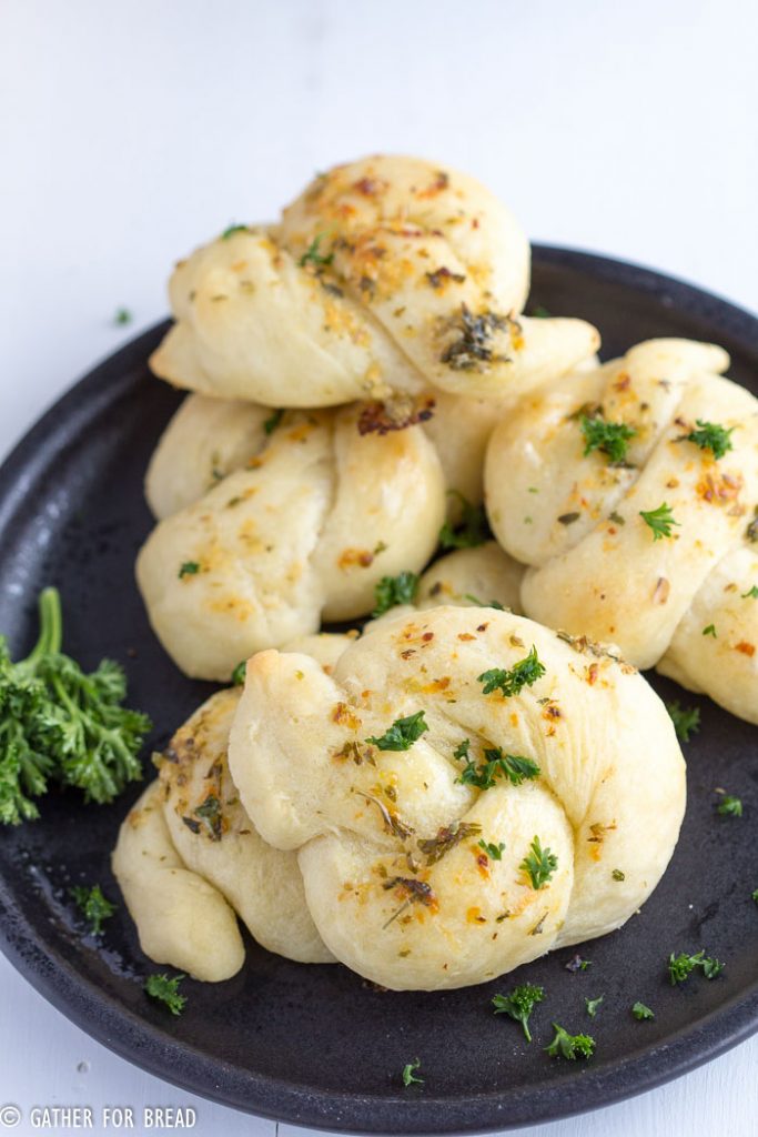 Homemade Garlic Parmesan Knots - Soft, knots topped with Fresh Parmesan, butter and garlic. | gatherforbread.com