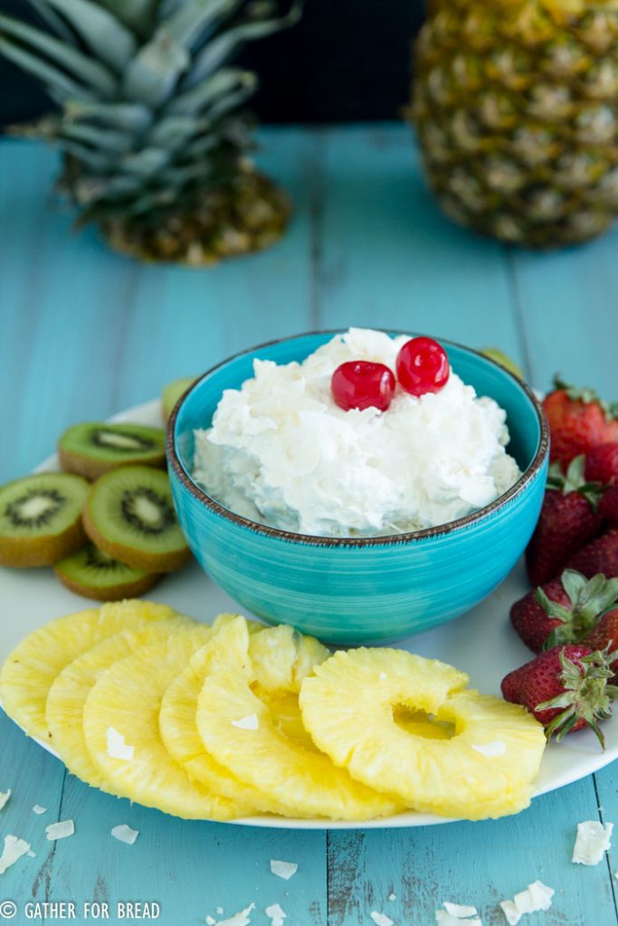Pina Colada Fruit Dip - Delicious creamy pina colada dip. Whips up with 4 easy ingredients. Made in minutes, perfect for dipping with fruits; strawberries, pineapple and kiwi.