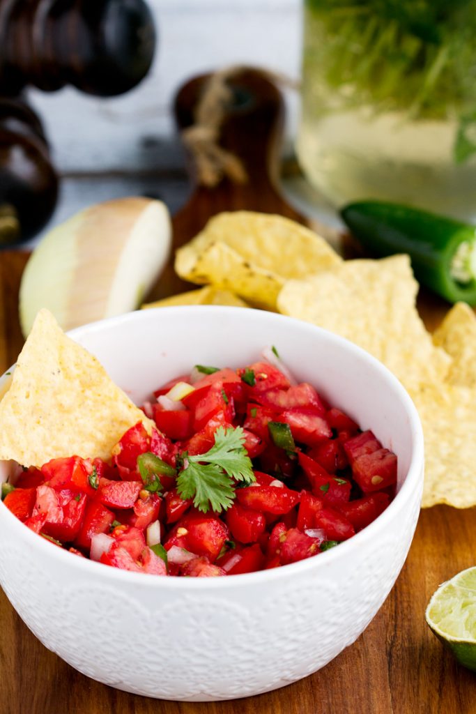 Fresh Homemade Tomato Salsa - Fresh tomatoes combine with onion, jalapeno, cilantro and seasonings for a perfect homemade Mexican flavor. Great summer starter or appetizer recipe for any meal or party.