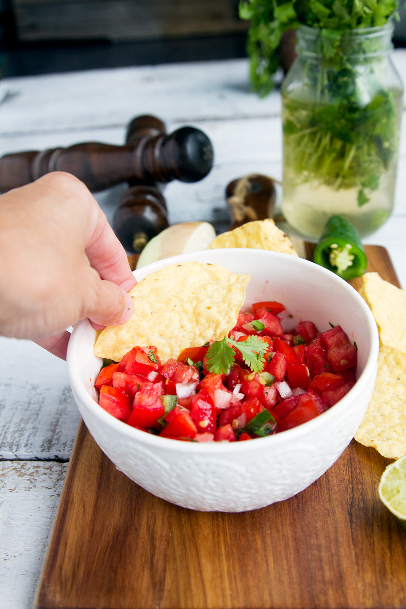 Fresh Homemade Tomato Salsa - Fresh tomatoes combine with onion, jalapeno, cilantro and seasonings for a perfect homemade Mexican flavor. Great summer starter or appetizer recipe for any meal or party.