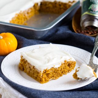 Pumpkin Cream Cheese Bars - Soft pumpkin bars, taste like cake, topped a sweet fluffy cream cheese frosting. Fall flavors that are perfect for a crowd like potlucks and bake sales.