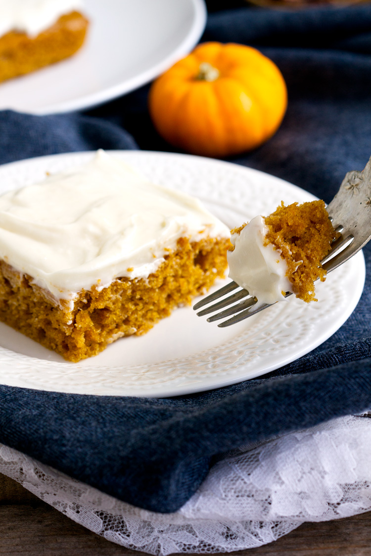 Pumpkin Cream Cheese Bars - Soft pumpkin bars, taste like cake, topped a sweet fluffy cream cheese frosting. Fall flavors that are perfect for a crowd like potlucks and bake sales.