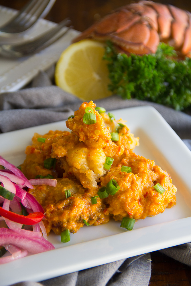 Gluten Free Spicy Lobster Bites - Lobster, lightly pan-fried succulent lobster. These gluten free bites are tossed in a spicy chili cream sauce.