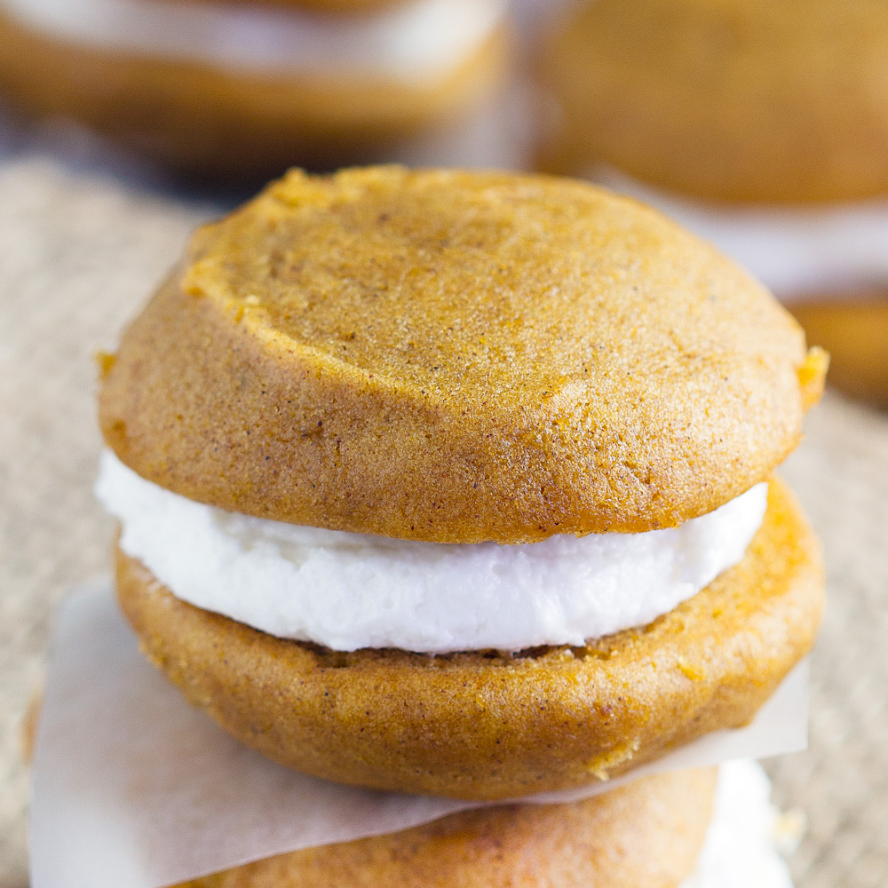 Pumpkin Whoopie Pies - Homemade Amish pumpkin whoopie pies perfect for autumn. Sandwich cookies are soft and perfect for sharing for bake sales and more. Our favorite fall treat!