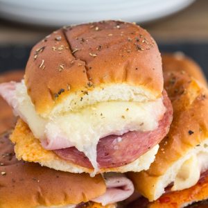 Italian Slider Sandwiches - Sliders stuffed with Italian meats, ham, salami, pepperoni, cheese, baked to perfection. Great appetizer for parties, gatherings