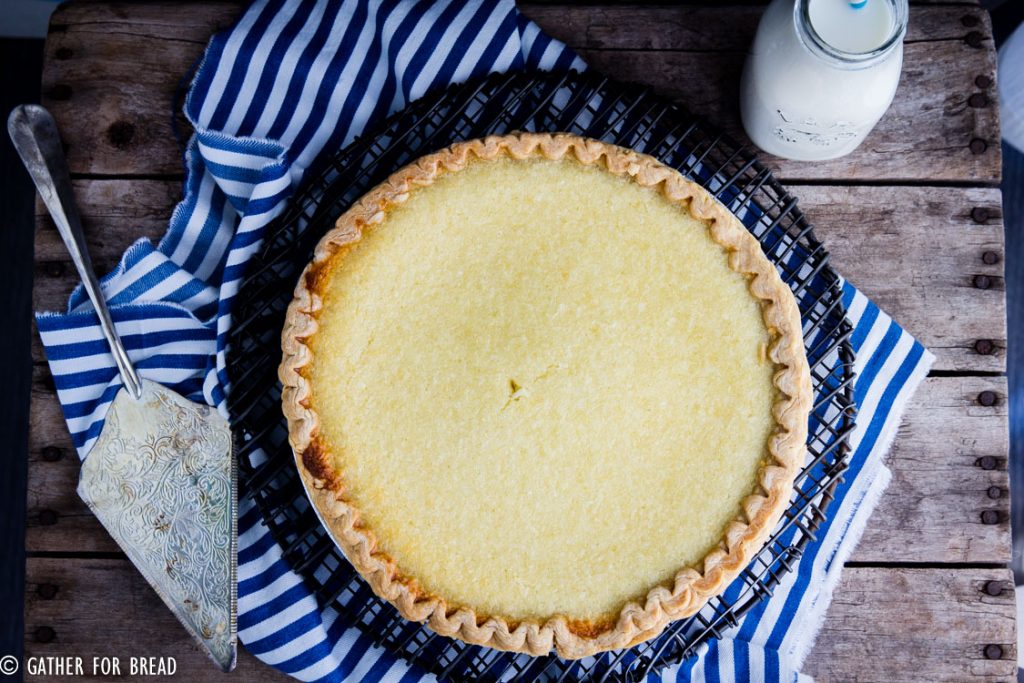 Homemade Coconut Custard Pie - Flaky coconut pie made with real custard baked in a pie crust for a perfect old fashioned taste, just like grandma made. Real ingredients like eggs, coconut milk and organic sugar.