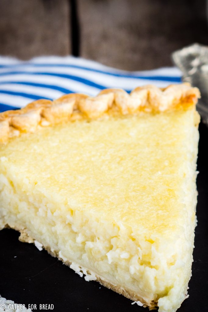 Homemade Coconut Custard Pie - Flaky coconut pie made with real custard baked in a pie crust for a perfect old fashioned taste. Easter and Thanksgiving favorite! #pie #coconut #oldfashioned