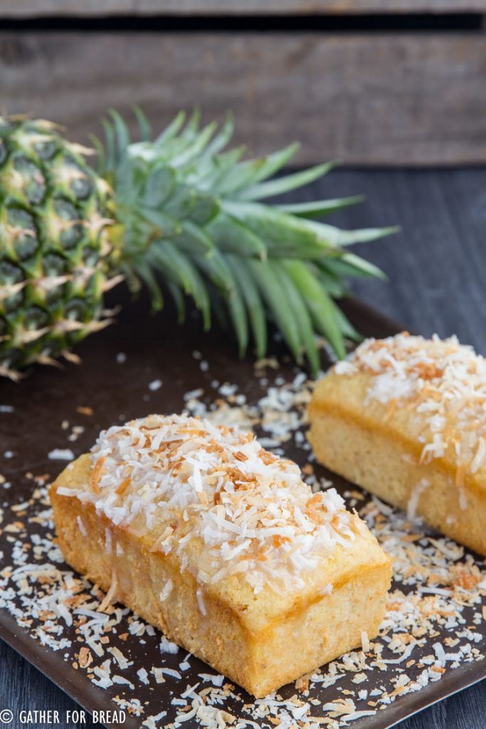 Pina Colada Quick Bread - Moist mini loaves with pineapple, coconut cream for a fresh Hawaiian taste of the tropics in a quick easy batch of bread. Decadent, moist and delicious, you'll be mix and make this often if you love the tropical taste.