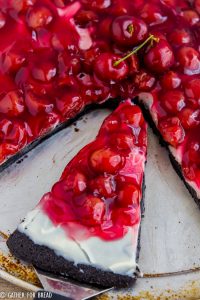 Chocolate Cherry Brownie Dessert Pizza - Cherry cheese dessert recipe with homemade brownies, fluffy cream cheese frosting and cherry pie filling for a sweet easy dessert.