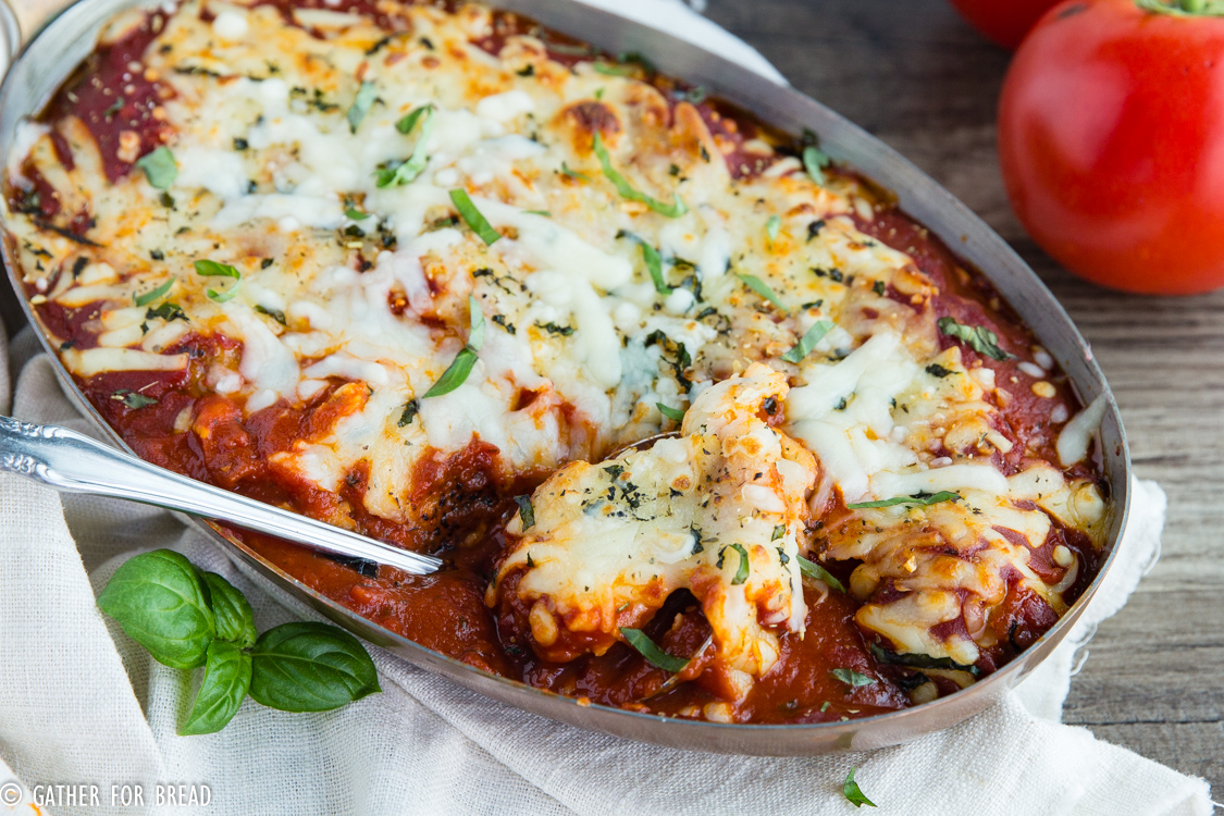 Baked Italian Meatballs- Enjoy this Easy Cheesy homemade Italian meatball casserole baked in the oven. Serve with garlic bread for a homemade meal that's simple and tasty.