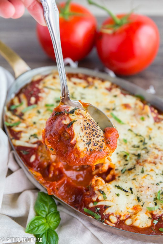 Baked Italian Meatballs- Enjoy this Easy cheesy homemade Italian meatball casserole baked in the oven. Serve with garlic bread for a homemade meal that's simple and tasty.
