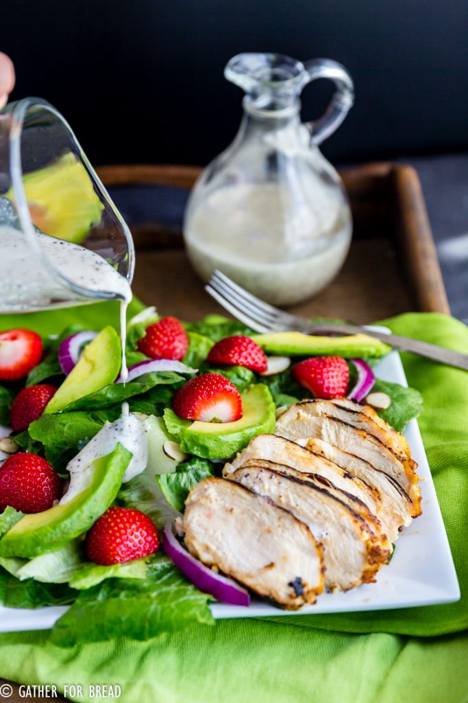 Grilled Chicken  Salad with Strawberries and  Poppy Seed Dressing - Savory romaine greens topped with fresh grilled chicken paired with strawberry, avocado, and sweet onion poppy seed dressing.