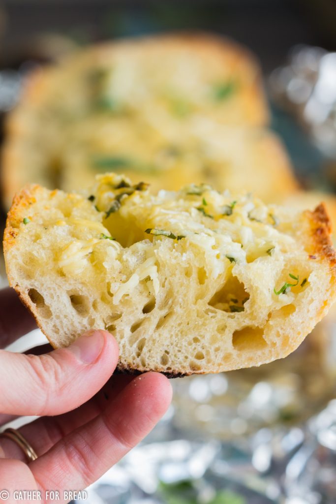 Grilled Garlic Bread - How to grill garlic bread. Grilling Italian loaf bread with butter, olive oil and herbs for a delicious summer side or appetizer.