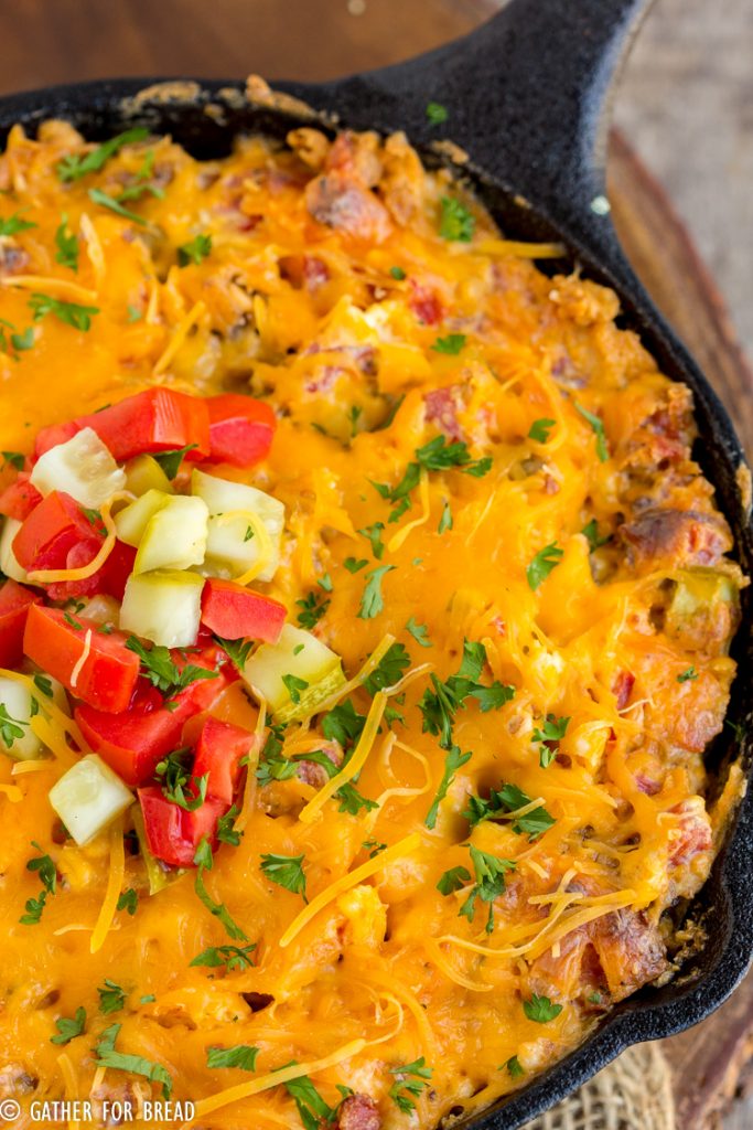 Easy Cheeseburger Dip - Ground beef mixed with cream cheese and cheddar cheese for a flavor burst of a cheeseburger in easy to make appetizer. Serve with hamburger bun dippers or your favorite cracker of tortilla chip.