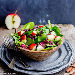 Harvest Apple Feta Salad - Delicious fall salad, greens with chopped apple, Feta cheese, cranberries and a sweet Maple cinnamon vinaigrette recipe made with apple cider vinegar.